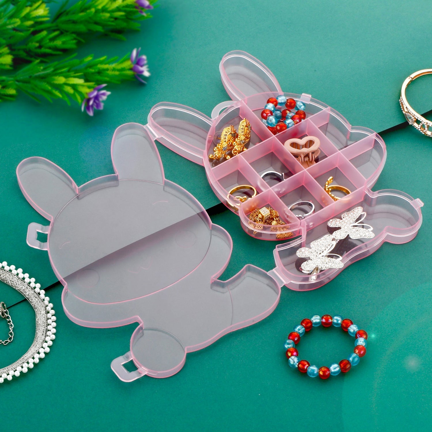 Bear-shaped clear plastic storage box for jewelry. Bear-shaped clear plastic storage box for jewelry.